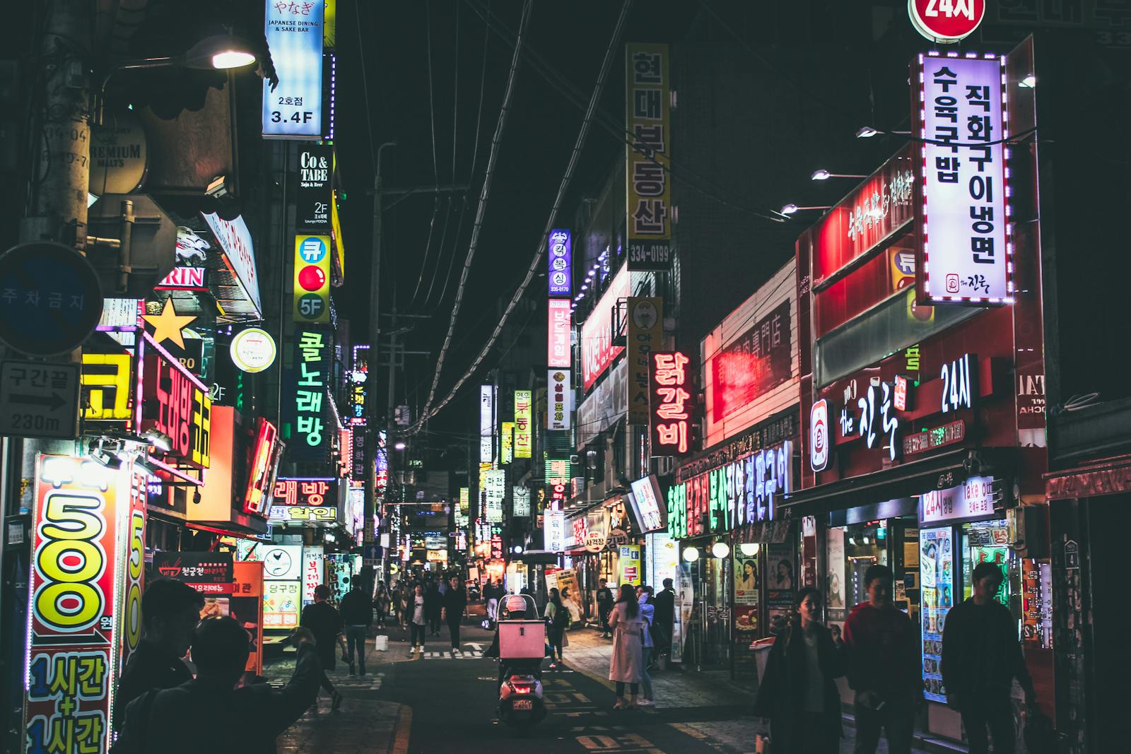 Lively Seoul street at night with neon signs