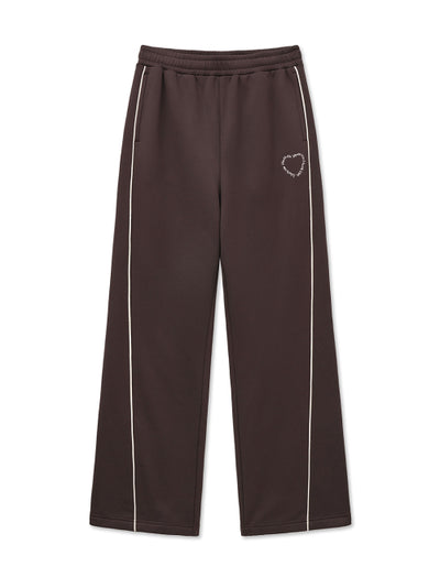 MATIN KIM Heart Logo Track Pants in Brown
