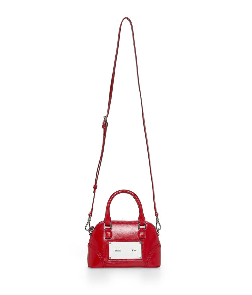 MATIN KIM MATIN KIM CURVE ZIP MINI BAG