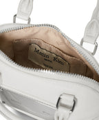 MATIN KIM MATIN KIM CURVE ZIP MINI BAG in Light Grey