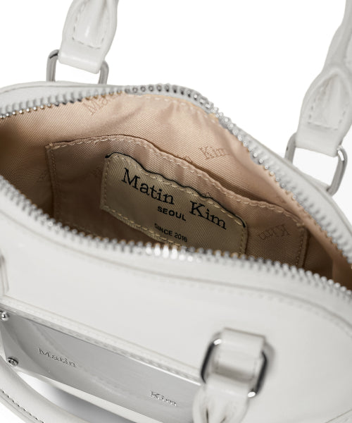 MATIN KIM MATIN KIM CURVE ZIP MINI BAG in Light Grey