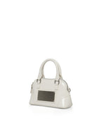 MATIN KIM MATIN KIM CURVE ZIP MINI BAG in Light Grey